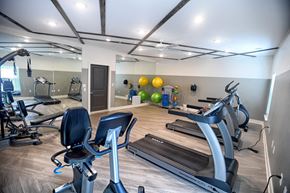 Greenville apartment for rent - A gym with treadmills, exercise bikes, and other equipment.