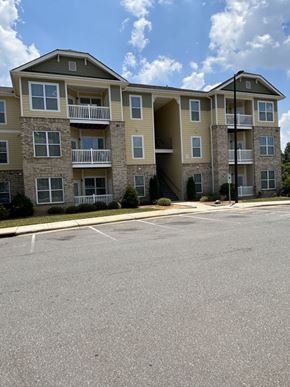 Charlotte apartment for rent - an apartment building with an empty parking lot