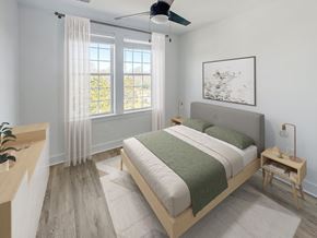 Greenville apartment for rent - Gordon Street Lofts Bedroom with bed, rug, dresser and floor-to-ceiling curtains.