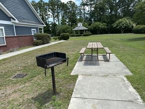 North Charleston apartment for rent - a picnic table and a grill in a yard