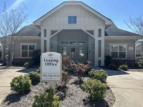 Kings Mountain apartment for rent - A leasing office building with a sign in front.