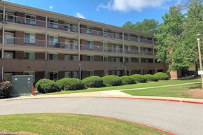 Columbia apartment for rent - A large apartment complex with a red line painted on the road.