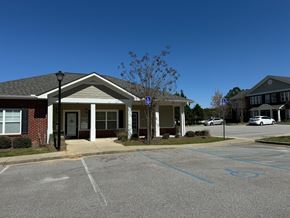 Columbia apartment for rent - A building with a parking lot in front of it.