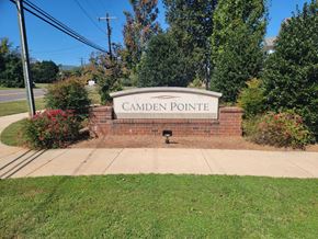 Mocksville apartment for rent - A sign that says Camden Pointe in front of a green lawn.
