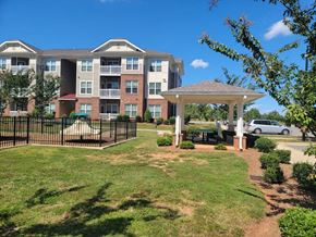Mocksville apartment for rent - A large apartment complex with a gazebo in the front yard.