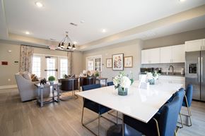 Charlotte apartment for rent - A modern dining room with a large table and chairs.