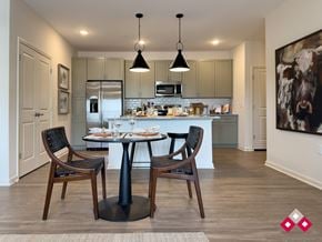 Flat Rock apartment for rent - A modern kitchen with a dining table and chairs.