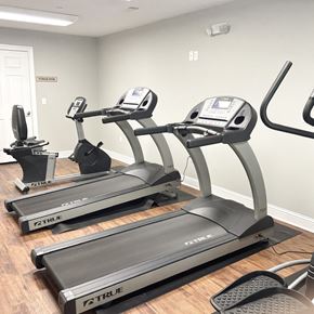 Greenville apartment for rent - A gym with treadmills and elliptical machines.