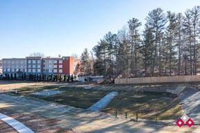 Flat Rock apartment for rent - A park with a playground and a building in the background.