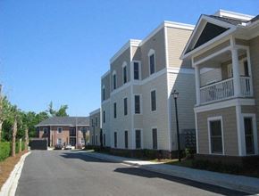 Charleston apartment for rent - a row of white houses on the side of a street