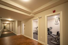 Spartanburg apartment for rent - A hallway with a gym in the background.