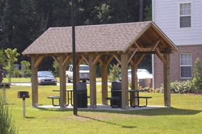 Beaufort apartment for rent - a man sitting on a picnic table in a pavilion