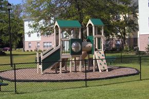 Beaufort apartment for rent - a playground with a slide and other playground equipment