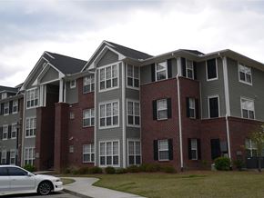 Summerville apartment for rent - an apartment building with a car parked in front of it