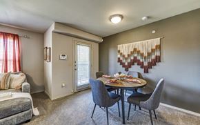 Hewitt apartment for rent - A dining room with a grey table and chairs.