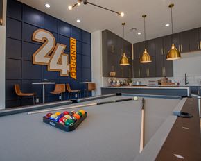 Oklahoma City townhouse for rent - A pool table with a 24 Hundred sign in the background.