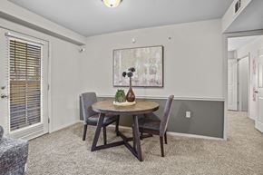 Owasso apartment for rent - A dining room with a table and chairs.
