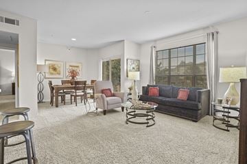 Oklahoma City apartment for rent - A living room with a grey sofa and a coffee table.