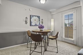 Oklahoma City apartment for rent - A dining room with a table and chairs.