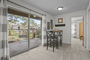 Oklahoma City apartment for rent - A dining room with a table and chairs is shown.