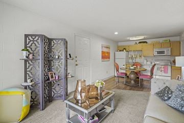 El Paso apartment for rent - A living room with a white couch and a coffee table.