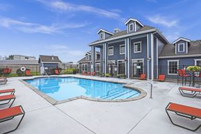 Wichita apartment for rent - A large house with a pool in the backyard.
