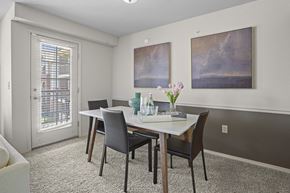 Yukon apartment for rent - A dining room with a table and chairs.