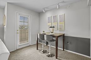 Wichita apartment for rent - A dining room with a table and chairs.