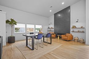 Stillwater apartment for rent - A modern dining room with a glass table and chairs.