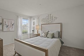 Amarillo apartment for rent - A bedroom with a large bed and a wall art.