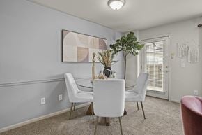 Amarillo apartment for rent - A dining room with a white table and chairs.