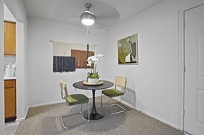 Amarillo apartment for rent - A dining room with a round table and chairs.