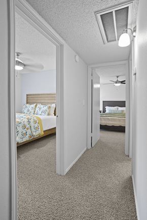Amarillo apartment for rent - A bedroom with a bed and a ceiling fan.