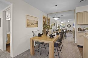 El Paso apartment for rent - A dining room with a wooden table and chairs.
