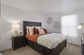 El Paso apartment for rent - A bedroom with a large bed and two nightstands.