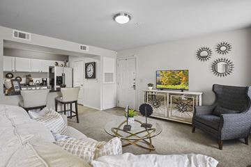 Lubbock apartment for rent - A living room with a white couch and a coffee table.