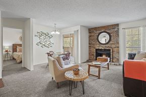 El Paso apartment for rent - A living room with a fireplace and a brick wall.