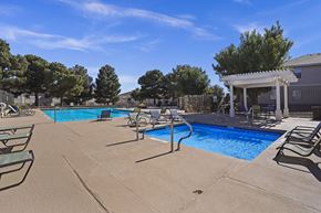 El Paso apartment for rent - A pool area with chairs and a gazebo.
