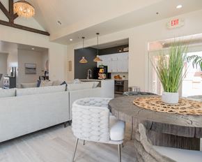 Oklahoma City apartment for rent - A modern kitchen with a dining area and a white sofa.