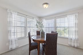 Edmond apartment for rent - A dining room with a table and chairs.