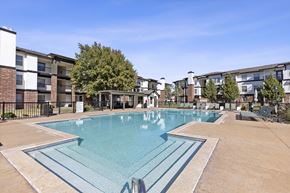 Lubbock apartment for rent - A large swimming pool in a residential area.