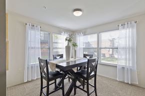 Lubbock apartment for rent - A dining room with a table and chairs.