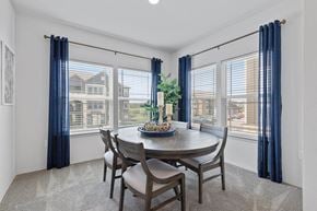 Kansas City apartment for rent - A dining room with a round table and chairs.
