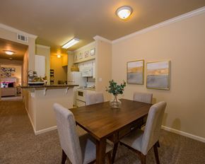 North Little Rock apartment for rent - A dining room with a table and chairs.