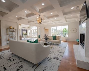North Little Rock apartment for rent - A modern living room with a large sofa and a fireplace.