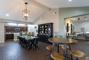 El Paso apartment for rent - A modern kitchen with a dining table and chairs.
