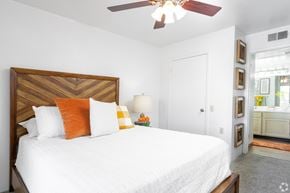 El Paso apartment for rent - A bedroom with a large bed and a ceiling fan.