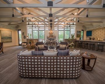 Oklahoma City apartment for rent - A living room with a large sofa and a coffee table.