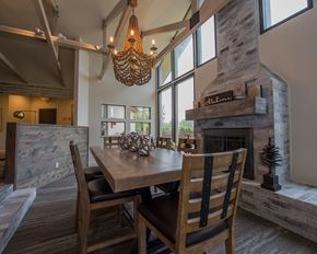 Oklahoma City apartment for rent - A dining room with a wooden table and chairs.