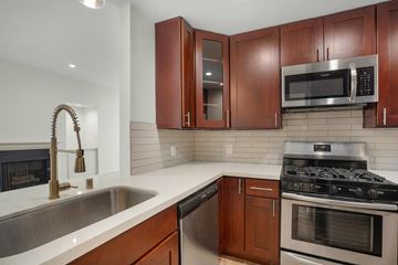 Los Angeles apartment for rent - a kitchen with stainless steel appliances and wooden cabinets